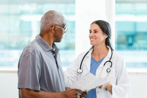 doctor-and-senior-male-patient-discussing-test-exam-information